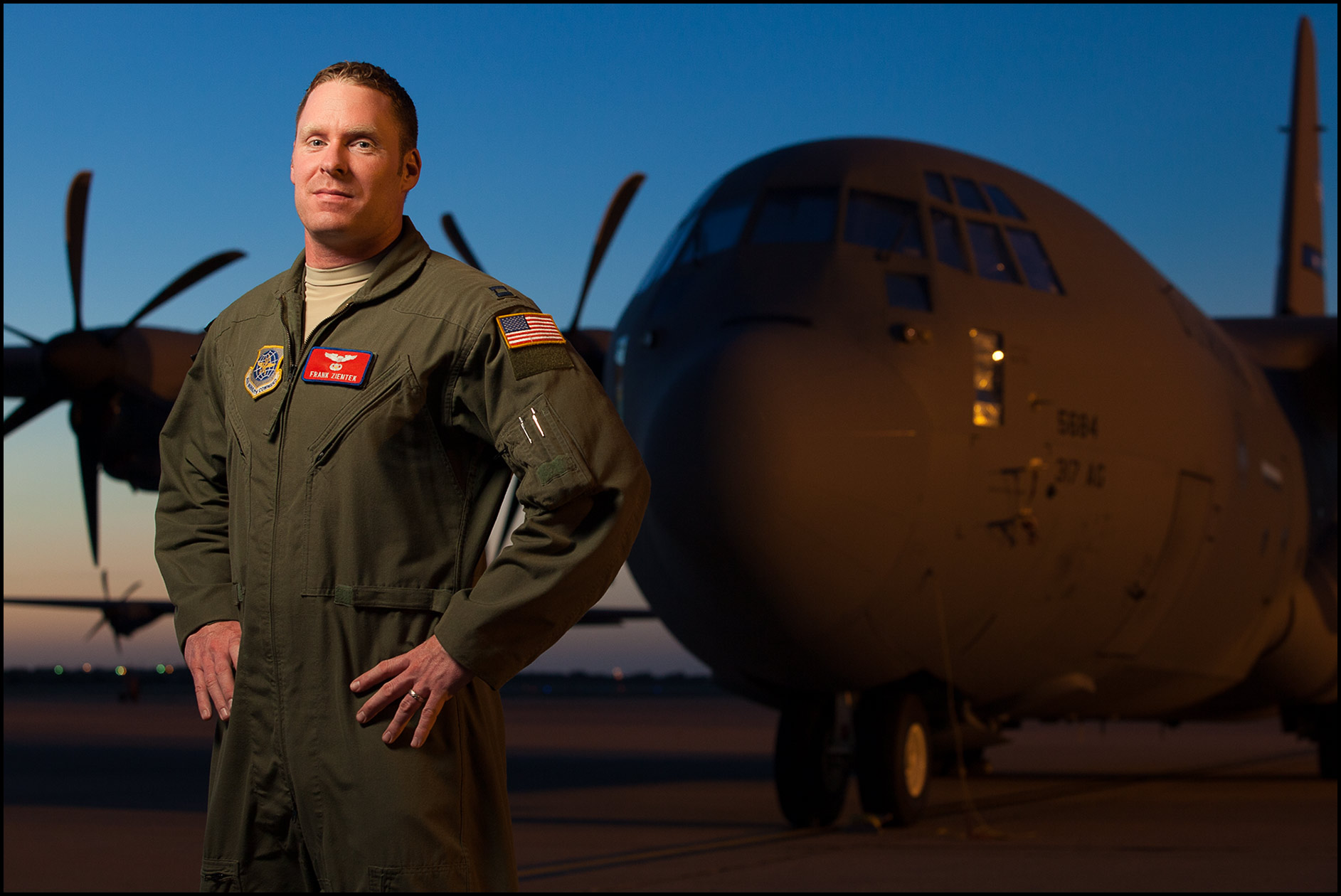 A portrait of a USAF Captain in front of a C-130 J transport aircraft at Dyess AFB.